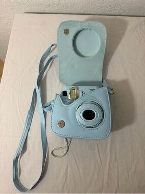 Instax Light Blue Instant Camera with Matching Light Blue Case and Strap